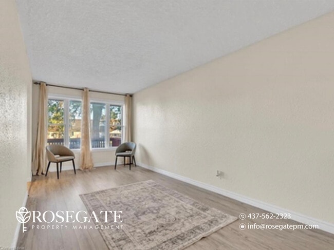 Photo - Spacious 3-Bedroom Main Level Apartment with Backyard & 3 Parking – Cambridge Unit 1