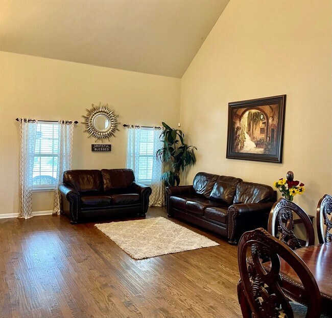 Photo - Elegant four-bedroom corner-lot home with hardwood floors, modern kitchen, master suite, and comm...