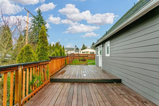 Photo - Spacious 4-Bedroom Tacoma Home with Fireplace & Deck **$500 OFF FIRST MONTHS RENT**