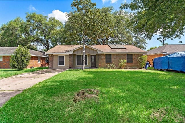 Building Photo - Beautifully remodeled 4 bedroom bath and a half with ceramic tile through out and laminate floori...