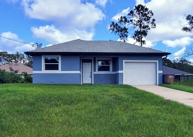 Building Photo - Great Location in Lehigh Acres, 3/2/1 in G... Rental