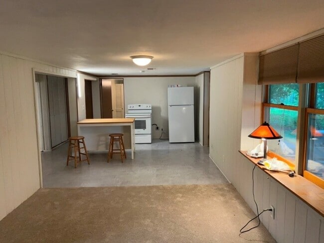 Living room facing kitchen - 5813 W 25 1/2 St Unit Lower Level