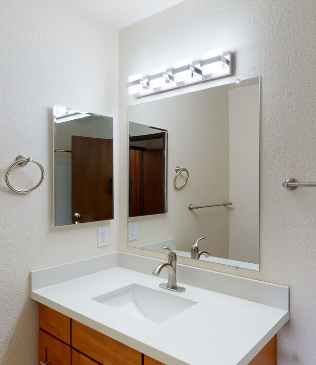 Single Sink Bath (we now use white countertops throughout) - Wingate Apartments