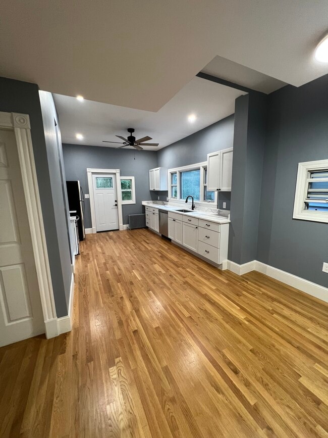 Eat-in kitchen with granite countertops and stainless steel appliances - 111 Falcon St Unit 2