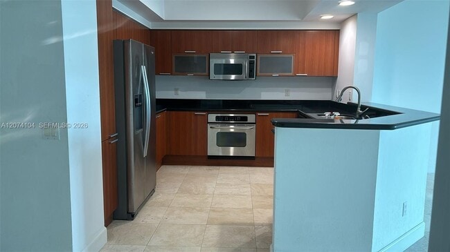 Building Photo - 14951 Royal Oaks Ln Unit 702