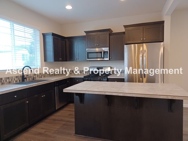 Photo - 3 Level End Unit Townhome with Newer Carpet, Open Floor Plan, 2 Balconies, 2 Car Attached Garage ...