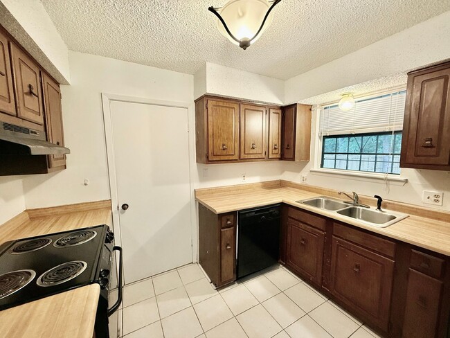 Photo - Charming 3BR/2BA Brick Home in Perkins Village – Spacious Yard & Cozy Fireplace