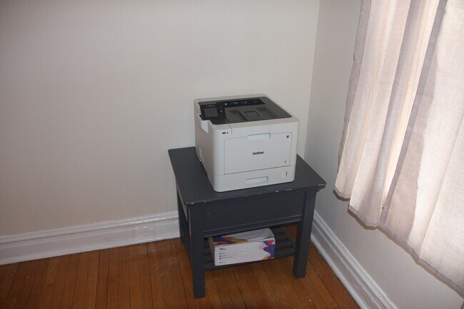 Yes...This is a Brother wireless laser color printer for you to use. Every student's dream. - 1415 W Rosemont Ave Apartment Unit 1E