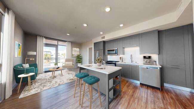 Gourmet kitchens with chefs-island with storage, stainless steel appliances and gas cooking - Modera Hollywood Apartments