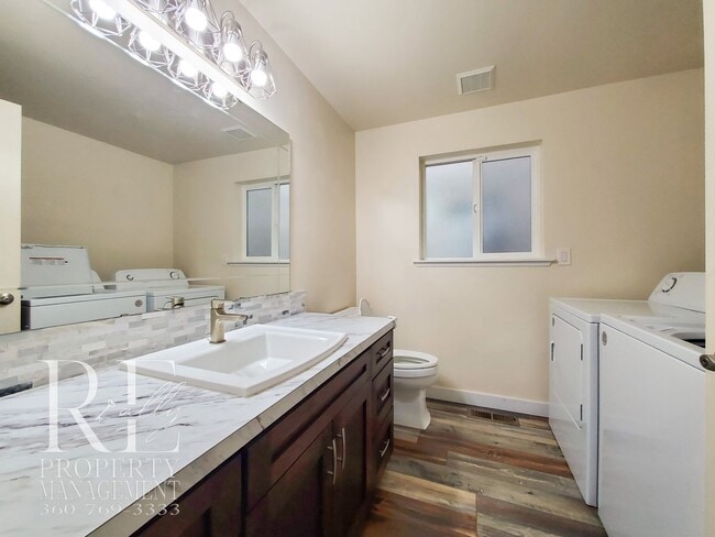 Photo - Modernized Two-Story with Open Layout, Gas Fireplace & Large Fenced Yard