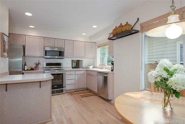 Photo - Elegant 3-Bedroom Home with Private Deck & Greenbelt Views!