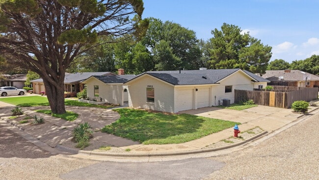 "Charming 4-Bed Oasis with Fireplace in Lubbock - 2 Full Baths & Spacious 2460 Sq Ft!"