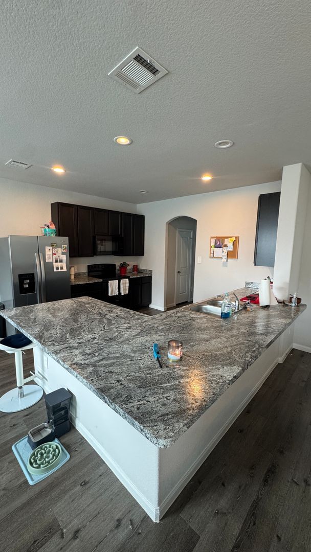 Photo - Entertainer’s Kitchen + Oversized Primary Suite | 4 Bed House in Bryan