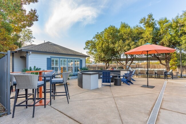 Our huge pool deck is complimented with patio tables, chairs, and umbrellas. Conveniently located right next to our state-of-the-art gym - Harvest Park Apartment Homes