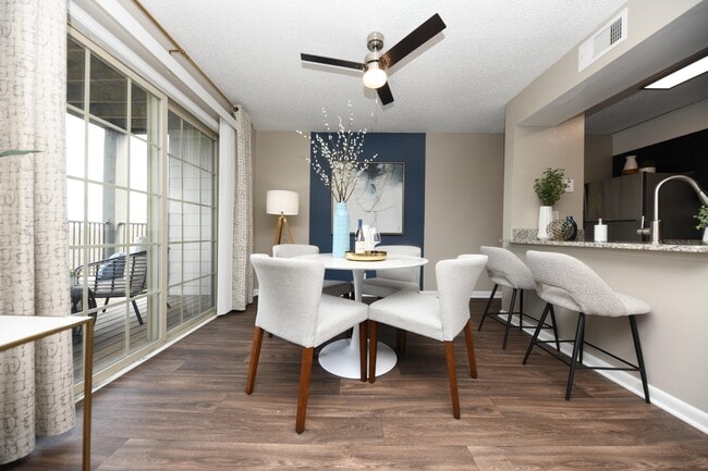 Dining area with hardwood-style flooring & ceiling fan