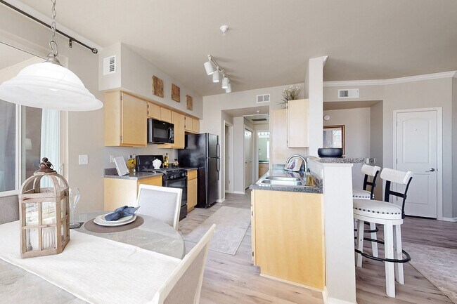 Step into this elegant kitchen designed for modern living, where functionality meets style. - Las Mananitas Apartments