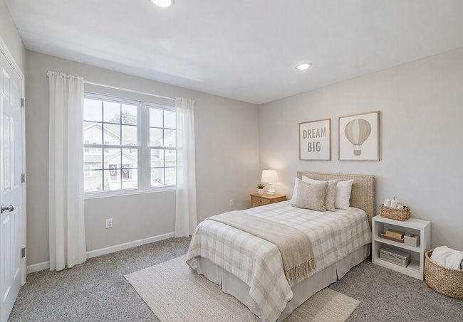 Neutral-toned bedroom with cozy details - Blue Ridge Luxury Townhomes
