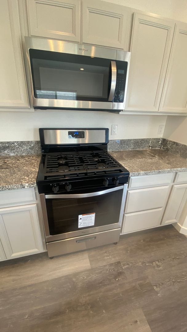 Photo - Brand new home with LVP flooring t/o, gran...