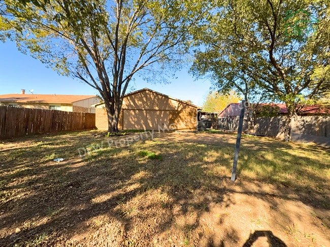 Photo - Cozy 3-Bedroom Home with Fireplace, Covered Patio & Large Fenced Backyard for Lease