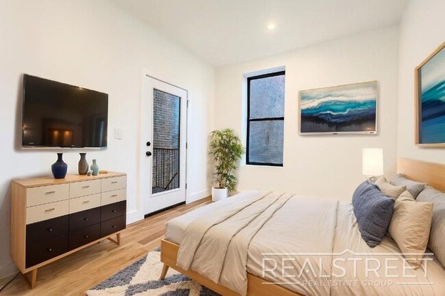 Photo - Modern Renovated 2BR with Skylight & Private Balcony in Prime Crown Heights