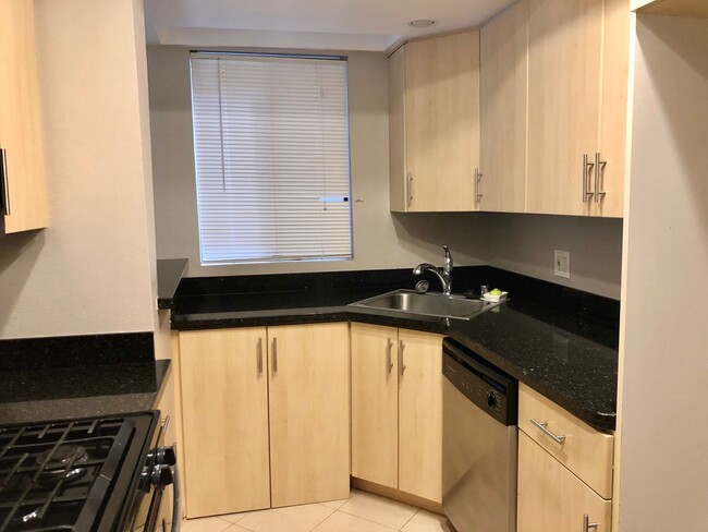 Photo - REMODELED CONDO WITH WOOD FLOORS! NEW KITCHEN! FIREPLACE! GYM, POOL! REC ROOM AND MORE