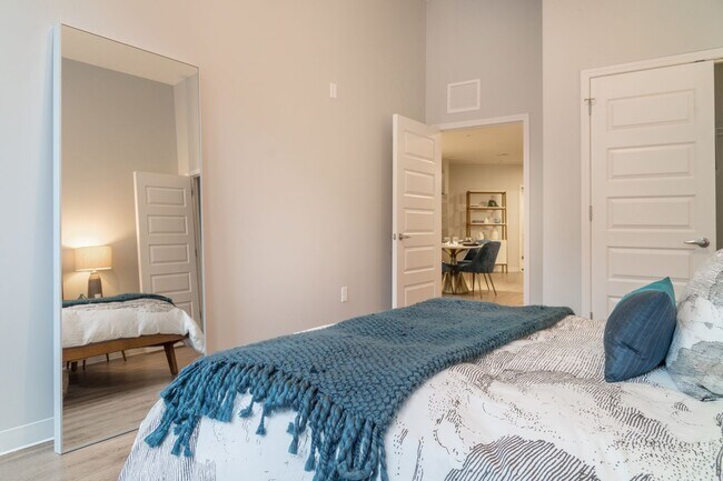 Bedroom with closet space and high ceiling