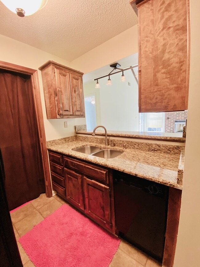 Photo - {12030 - F}  Updated Condo in Fantastic Location + Top Floor + Covered Parking Included + Private...