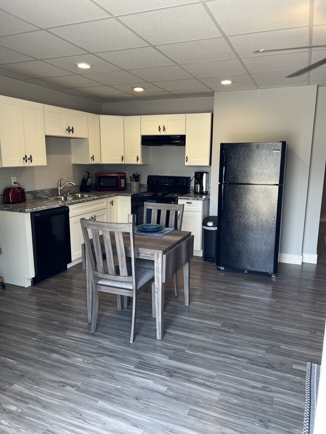 Fully stocked kitchen. Fridge has icemaker. Dishwasher is included! - 421 N 20th St Apartments Unit 104