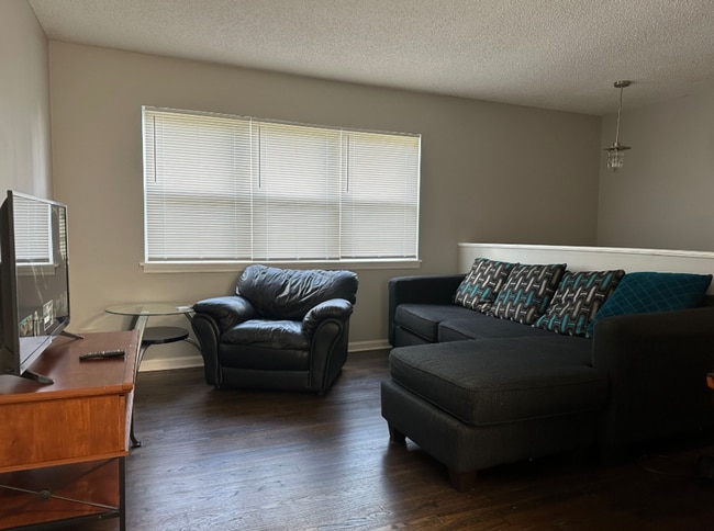 Photo - Spacious 4-Bedroom Home with Den, Fenced Yard & 3-Car Garage. Available Late July!