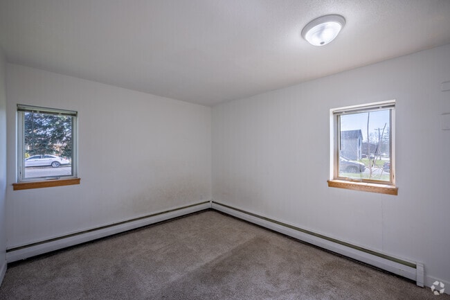 2BR, 1BA - 870SF - Primary Bedroom - Falls Apartments