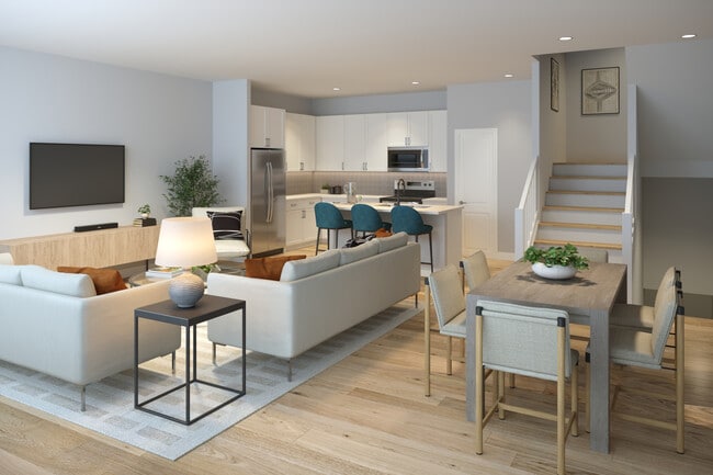 Townhomes featuring stainless steel appliances and seamless open concept kitchen, dining, and living spaces for modern living (Rendering)
