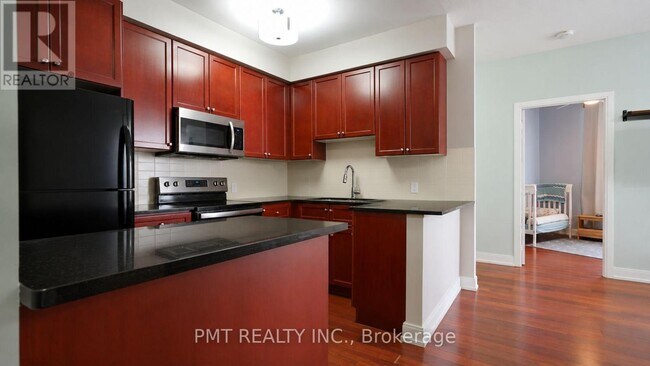Photo - 125 Village Green Square Unit 309