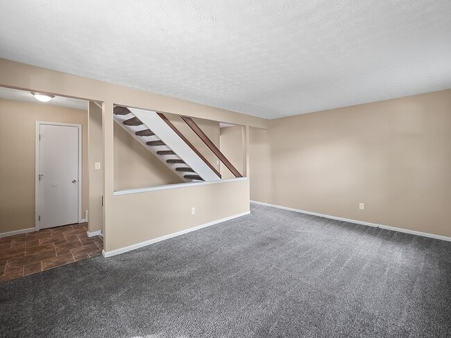 Townhome Living Room - McMillen Woods Apartments