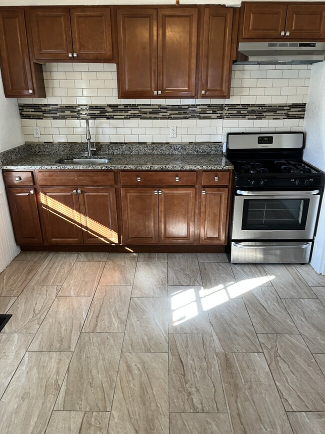 Granite Countertops, Stainless Steel Stove and Range Hood - 52 Germain Ave Townhome