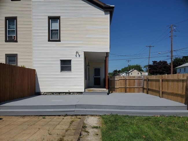 Photo - Pet friendly duplex w brand new kitchen & first floor LVP, basement, fenced yard, deck, near comm...