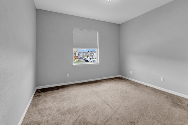 Photo - Beautiful low-maintenance ranch home with turf in front and back!