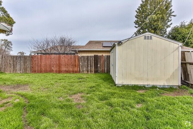 Building Photo - The updated kitchen features brand-new cou... Rental