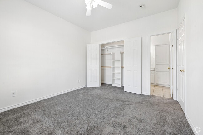 2BR, 2BA - 1,024SF - Primary Bedroom - Whispering Pines Apartments