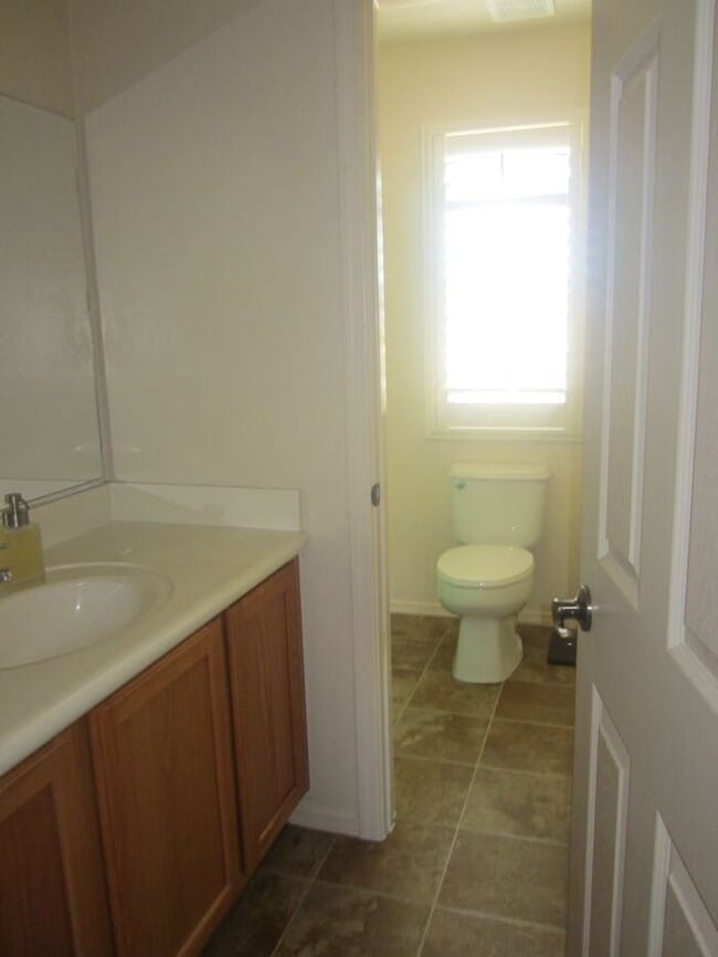 Photo - Adorable 2 story patio style with three spacious bedrooms and two full baths upstairs