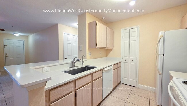Photo - MOVE IN READY! LARGE 2 BEDROOM/2 BATH PLUS ATTACHED GARAGE! TILE/LVP THROUGHOUT!