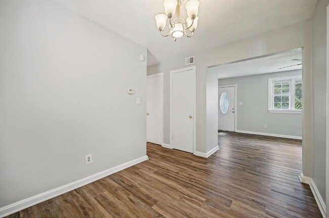 RARE FIND-4 BEDROOMS, 2 BATHROOMS, FENCED BACK YARD and GARAGE-PETS!!