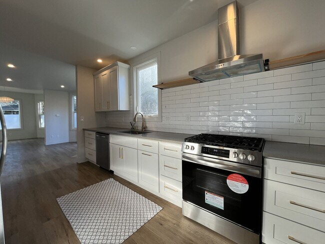 Photo - Updated Portland Home Featuring LVP Flooring, Modern Stainless Appliances, and Soaking Tub