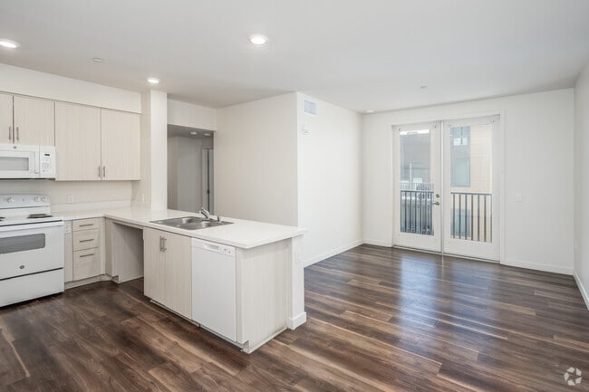 4BR, 2BA - 1,104SF - Kitchen and Living Room