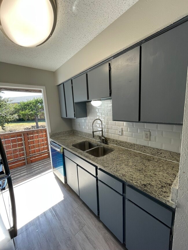 Kitchen leading to 2nd balcony