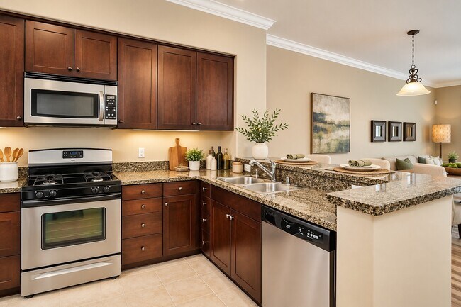 Step into luxury at The Pointe with this beautifully designed kitchen featuring stainless steel appliances, sleek granite countertops, and modern cabinetry. Perfect for both cooking and entertaining. Schedule your tour today to see it in person!
