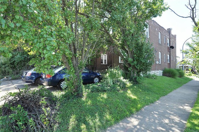 Shared parking pad at rear of unit. - 4169 Potomac St Apartments Unit 1W