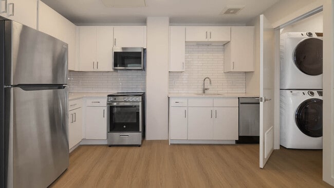 Kitchen with In-home Washer and Dryer - Skyhouse Denver