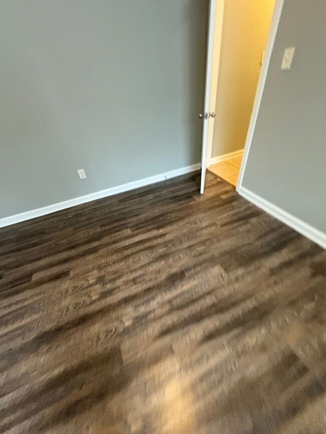 Photo - This 2BR/1BA includes a nice-sized living area, an ample kitchen, a fenced-in