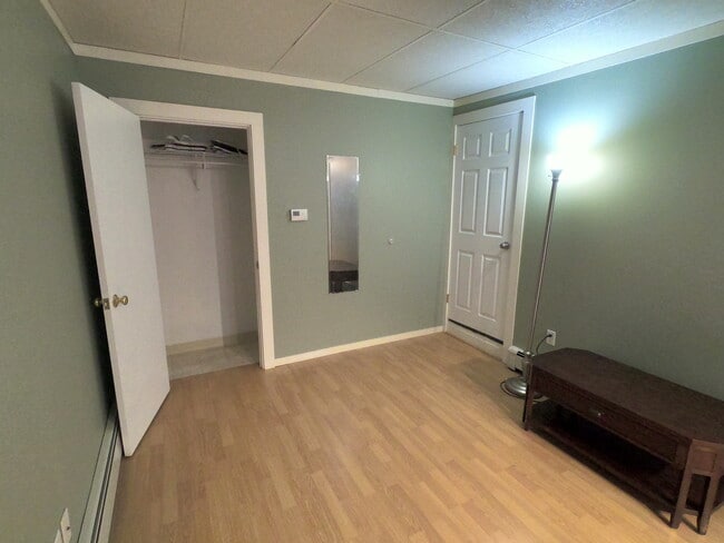 The bedroom has a small closet. - 303 Hanover St Unit 3