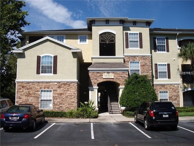 Building Photo - 10205 Courtney Palms Blvd Unit 203